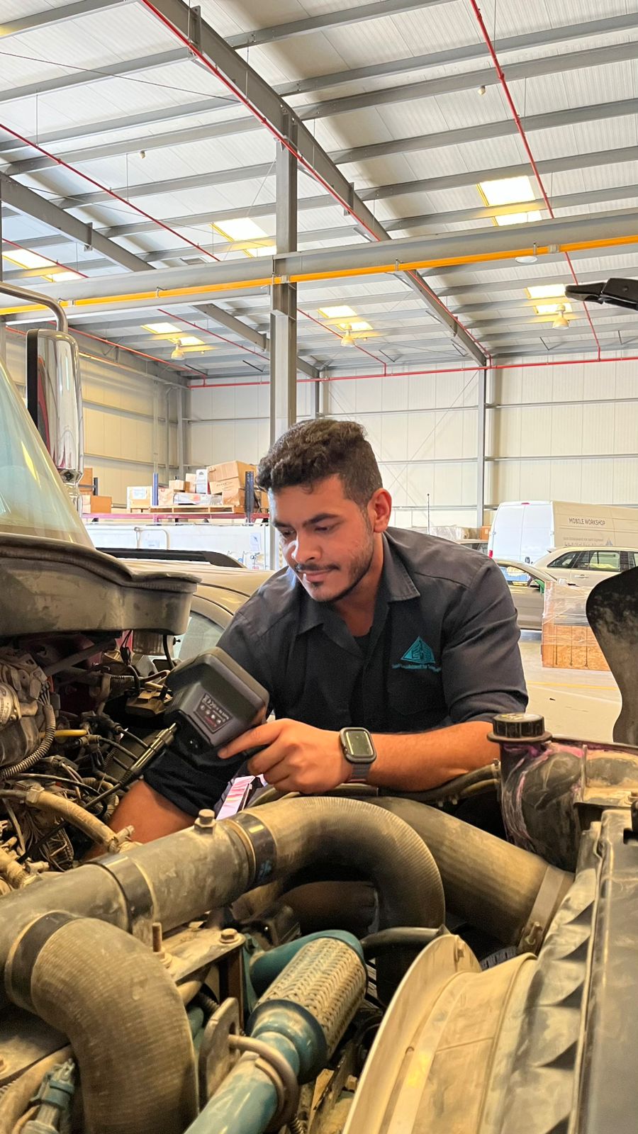 young man doing a car repair